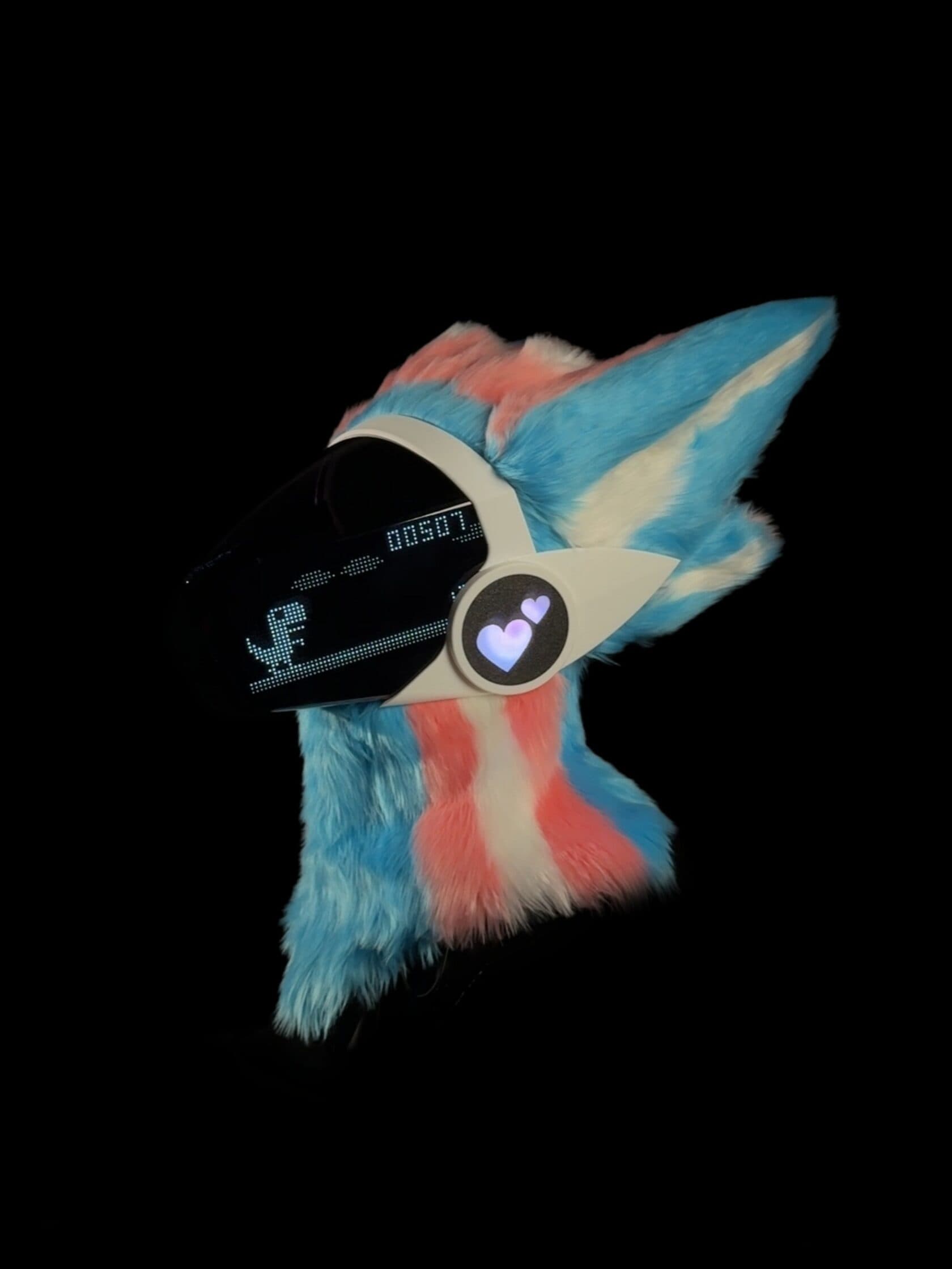 PRISM Protogen in pink, blue and white, with illuminated heart side panels